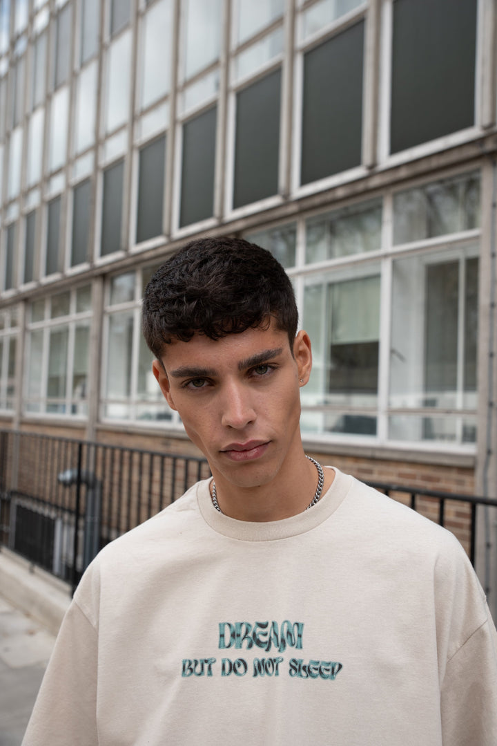 Short-Sleeved T-shirt in Sand with Cursive Logo Print by Dreambutdonotsleep