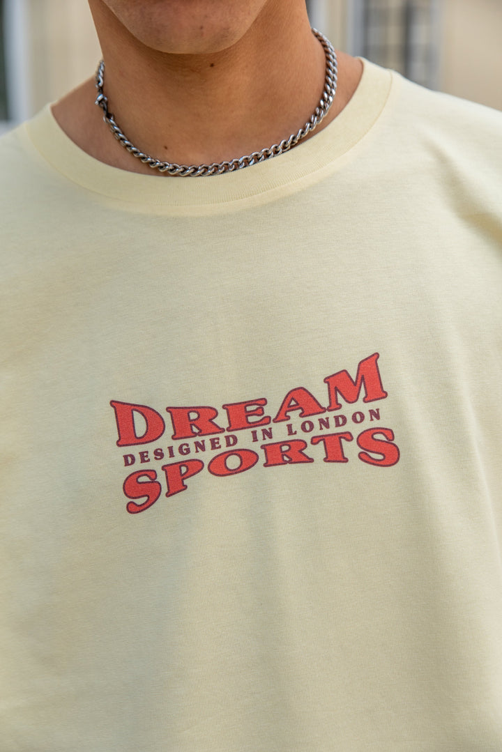 Short Sleeved T-shirt in Butter With Dream Sports Print by Dreambutdonotsleep