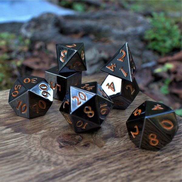 Black and Orange Sharp-Edged Metal Dice by Misty Mountain Gaming