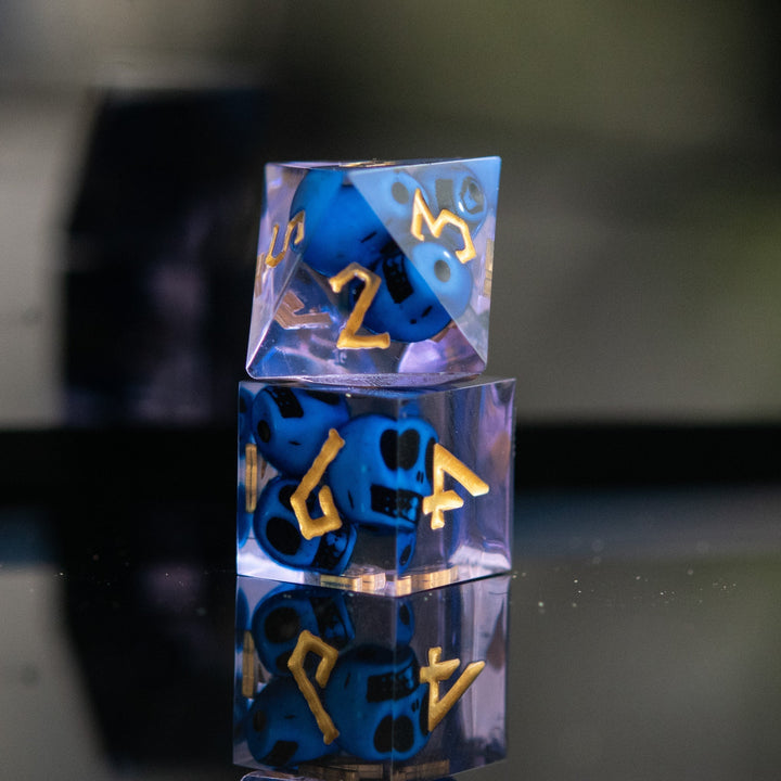 Corpse Blue and Lavender Sharp-Edged Resin Dice Set by Misty Mountain Gaming