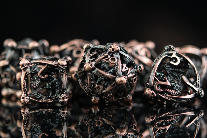 Draco Immortui Hollow Metal Dice Set - Bronze by Misty Mountain Gaming