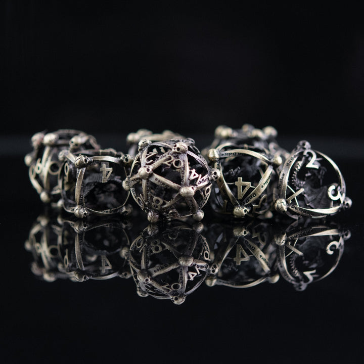 Draco Immortui Hollow Metal Dice Set - Champagne Gold by Misty Mountain Gaming