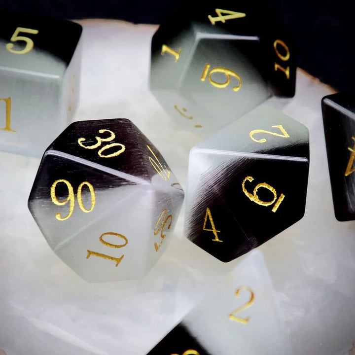 Gemstone: Black White Cat Eye Gold Numbers Dice Set by Haxtec