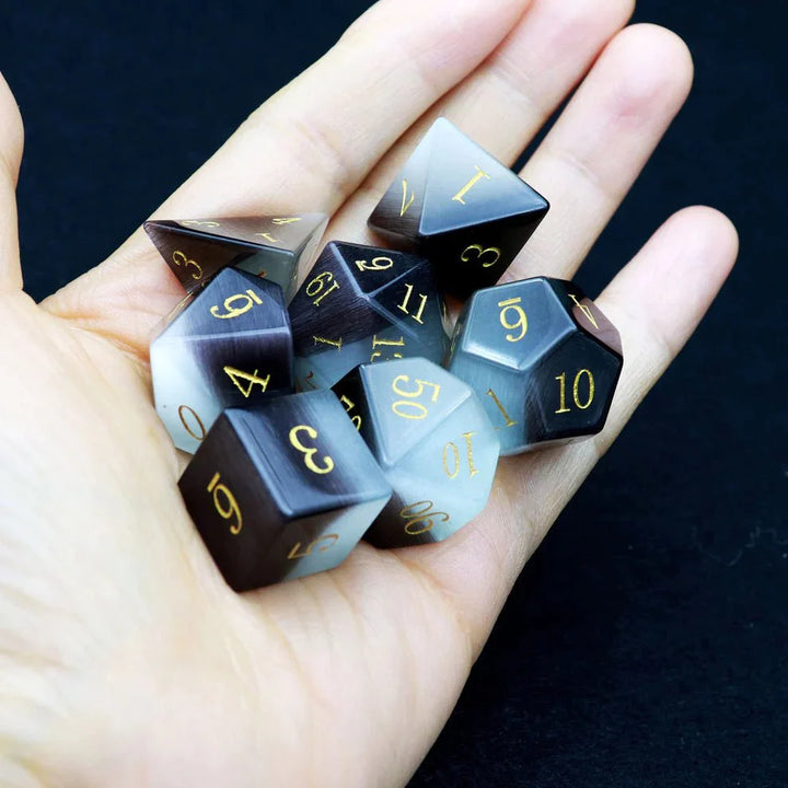 Gemstone: Black White Cat Eye Gold Numbers Dice Set by Haxtec