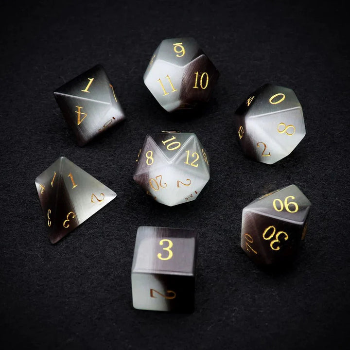 Gemstone: Black White Cat Eye Gold Numbers Dice Set by Haxtec