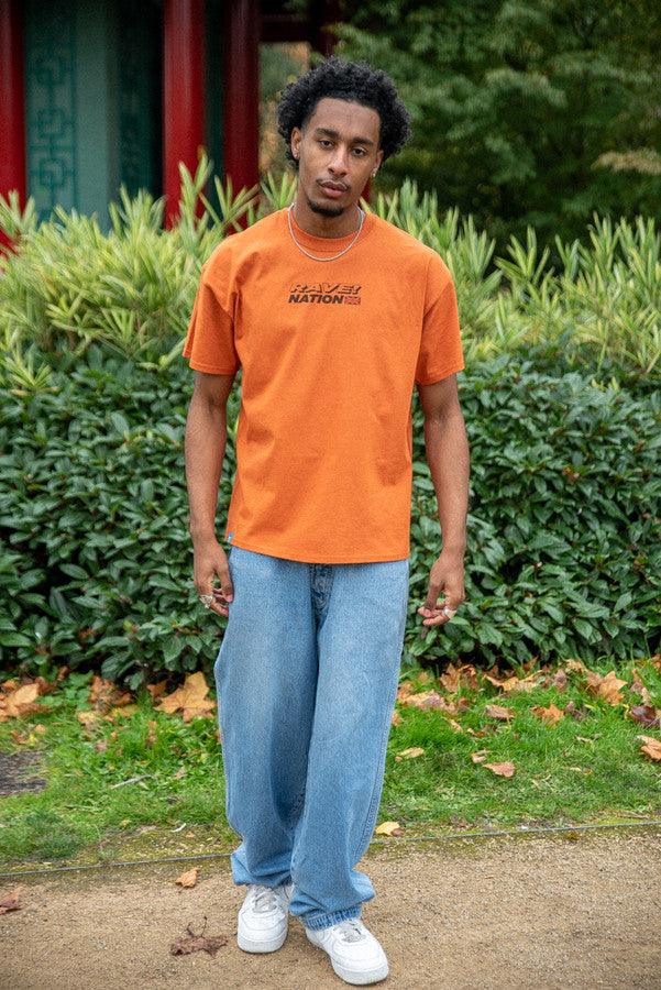 T-Shirt in Texas Orange With 90s Rave Smiley Positive Print by Dreambutdonotsleep