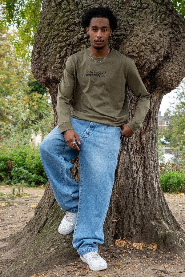 Long Sleeved T-Shirt in Army With 90s Rave Smiley Print by Dreambutdonotsleep