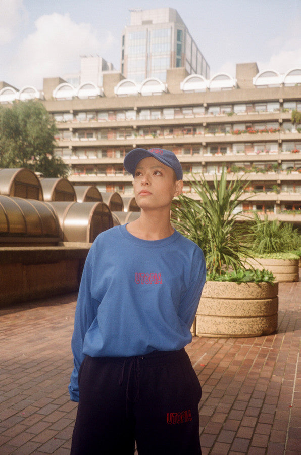 Royal Blue Long Sleeved T-shirt with Embroidered Utopia Logo by Dreambutdonotsleep