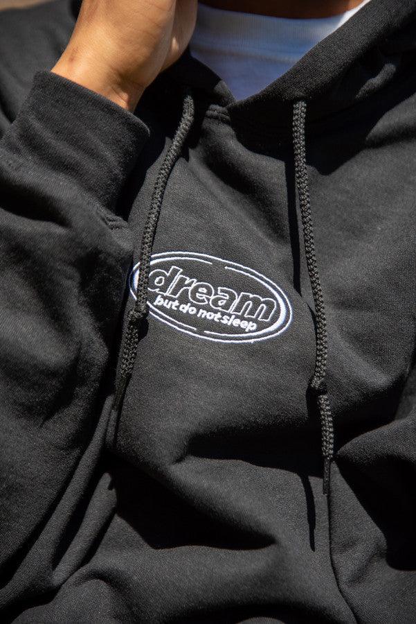 Hoodie in Black With Oval Logo Embroidery by Dreambutdonotsleep