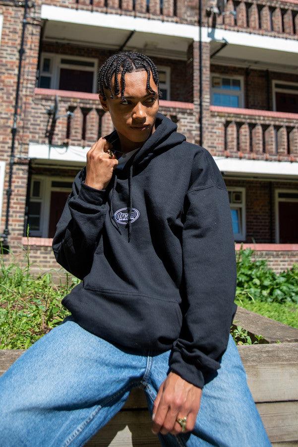 Hoodie in Black With Oval Logo Embroidery by Dreambutdonotsleep