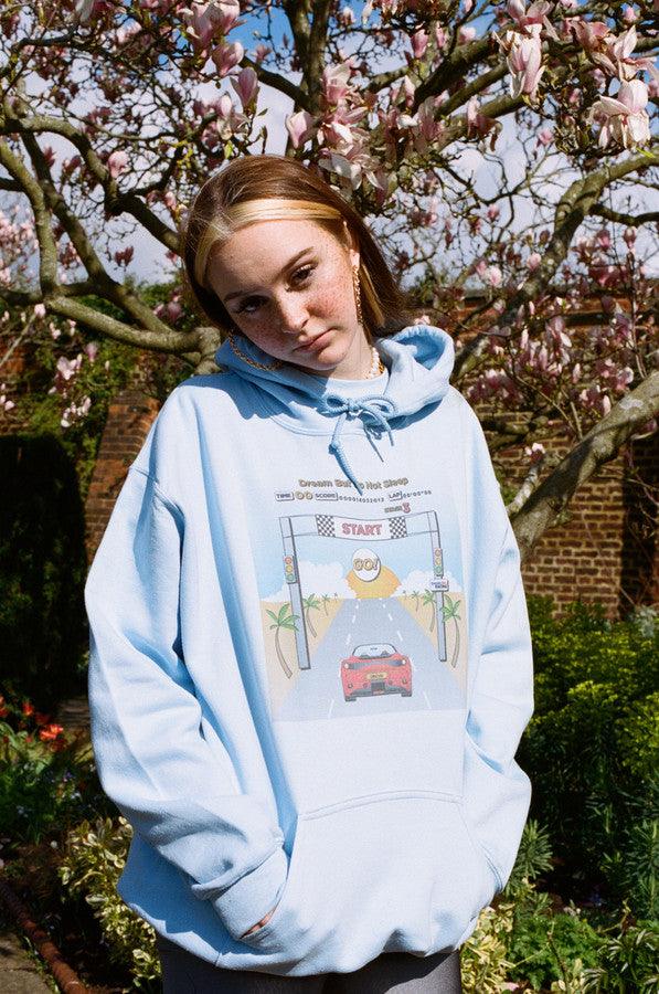 Hoodie In Light Blue With Drive In To The Sunset Print by Dreambutdonotsleep