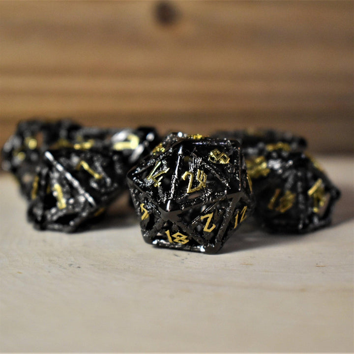 Legends of Valhalla - Black and Gold Hollow Metal Dice Set by Misty Mountain Gaming