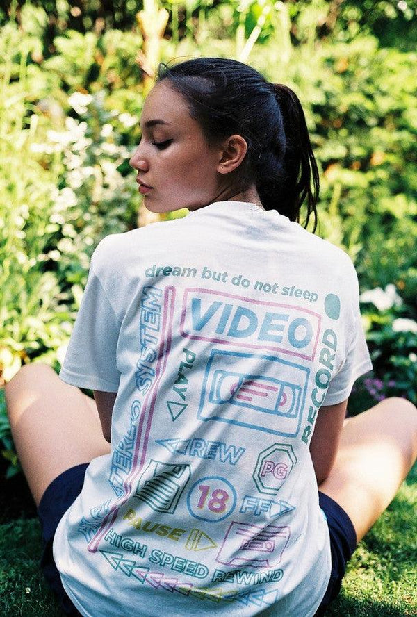 White Short Sleeved T-shirt With 80's VHS Design by Dreambutdonotsleep